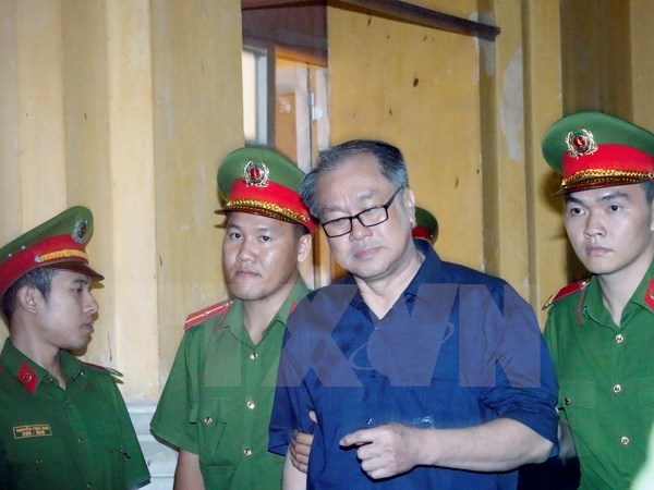 Pham Cong Danh (wearing glasses) (Source: VNA)