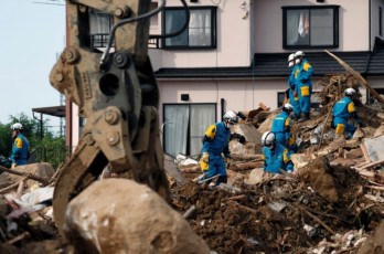 Japan flood toll nears 200, sun scorches thousands battling thirst