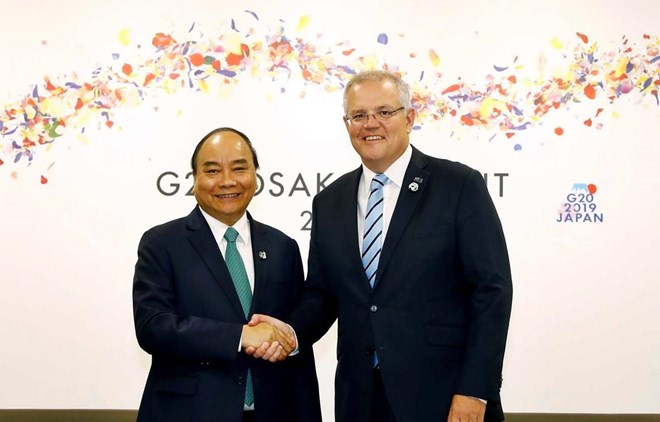 Prime Minister Nguyen Xuan Phuc (L) and Australian Prime Minister Scott Morrison at the G20 Summit in Japan (Photo: VNA)