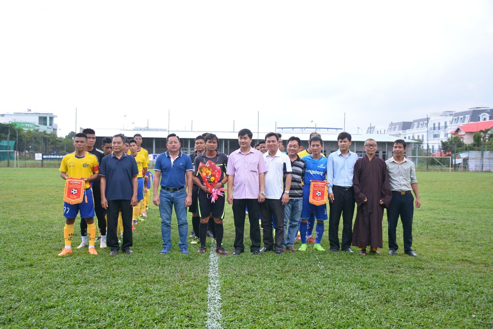 The Organizing Board offered flowers, souvenir flags to the referee team and participating football teams