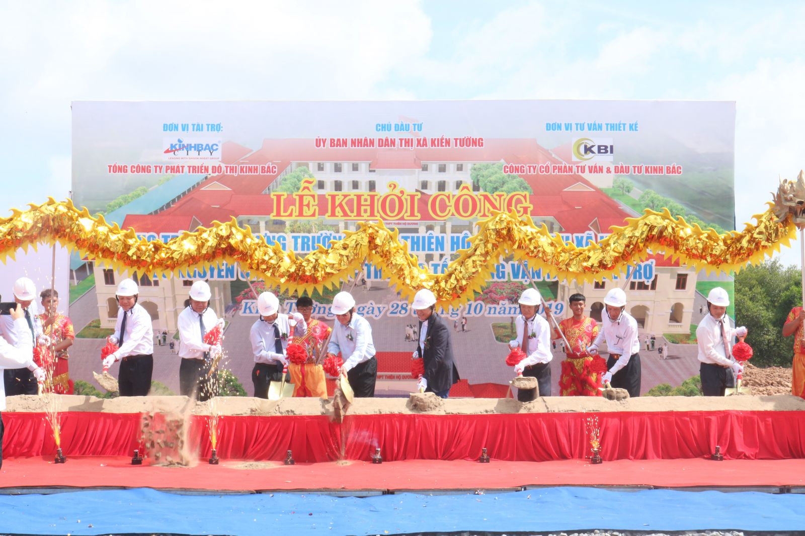 Delegates perform the groundbreaking ceremony