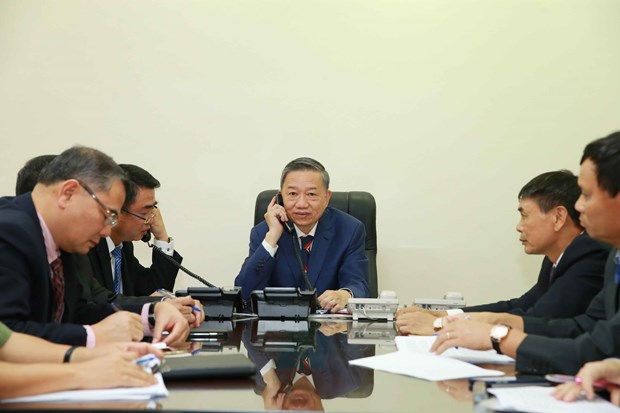 Gen. To Lam (C), Politburo member and Minister of Public Security, holds telephone talks with Home Secretary of the UK Priti Patel on October 30 (Photo: VNA)