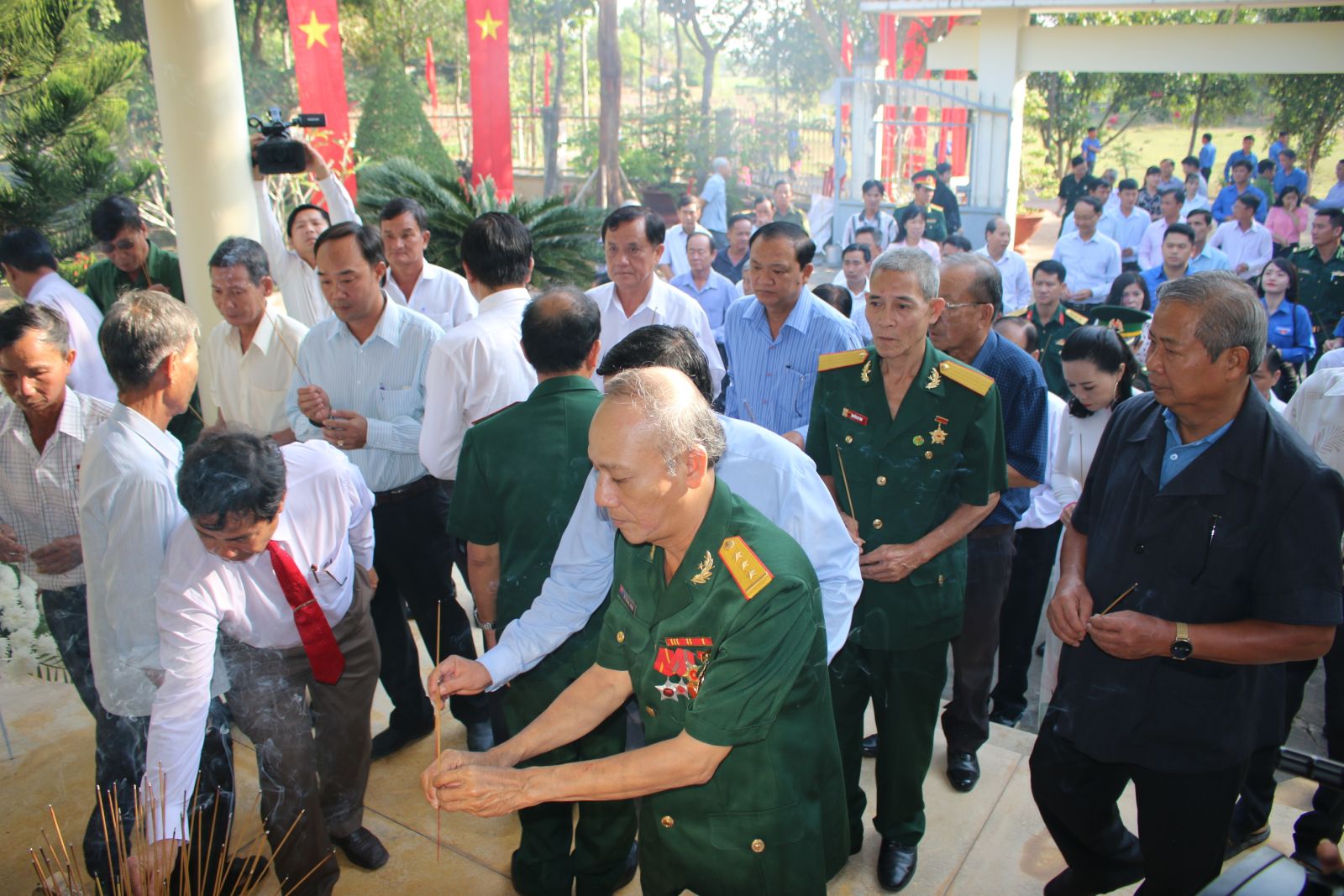 Delegates offer incense at the temple to commemorate the martyrs