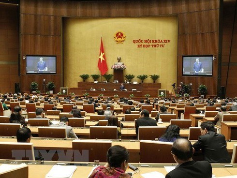 At a National Assembly meeting (Photo: VNA)