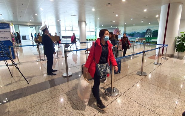 Passengers at Noi Bai International Airport in Hanoi (Photo: VNA)