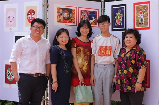 Nguyen Duc Huy (second from right) creates Chibi 'hat boi' figures with the aim of attracting more youngsters to the traditional art form (Photo courtesy of Nguyen Duc Huy)