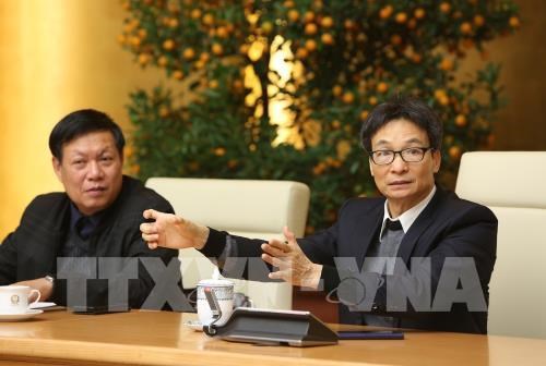 Deputy Prime Minister Vu Duc Dam (R) at the meeting (Photo: VNA)  