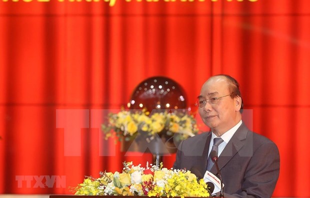 Prime Minister Nguyen Xuan Phuc speaks at a conference of the tax sector on February 26. (Photo: VNA)