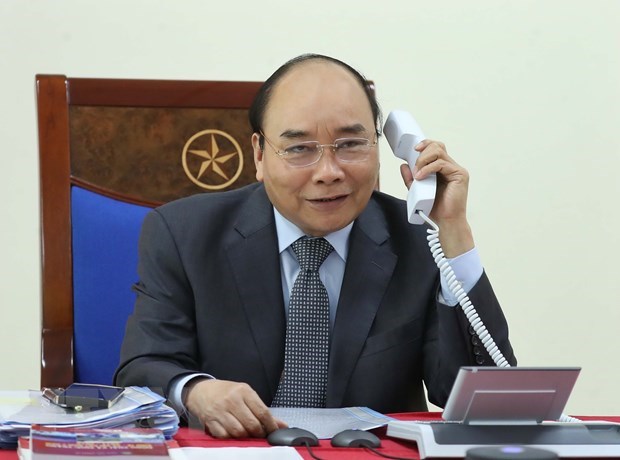 Prime Minister Nguyen Xuan Phuc on March 26 holds separate phone talks with his Lao and Cambodian counterparts. (Photo: VNA)