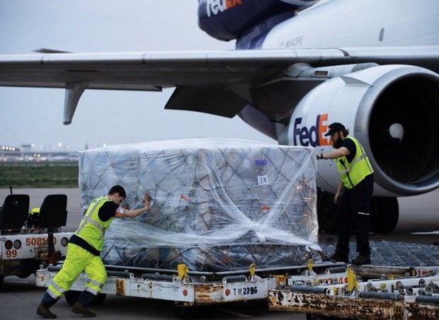 FedEx workers load the protective suits onto a plane for shipment to the US. (Photo: twitter.com/realDonaldTrump)