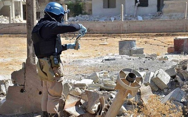 A UN staff member studying chemical weapons in Syria in 2013. (File photo of AP)