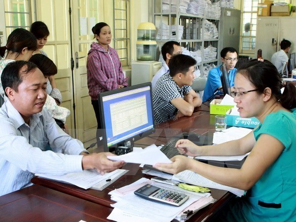 People registering for social insurance (Photo: VNA)