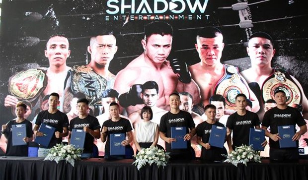 The martial artists at the signing ceremony (Photo: VNA)