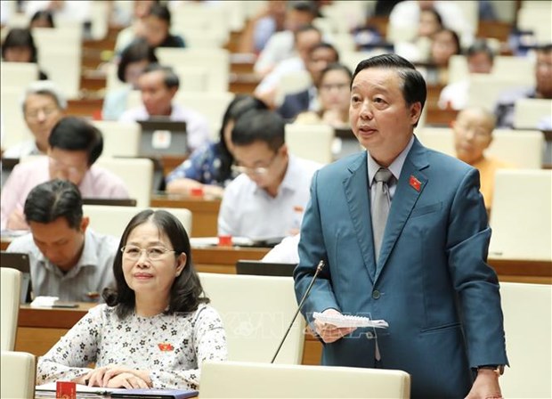 Minister of Natural Resources and Environment Tran Hong Ha speaks at the ninth session of the 14th National Assembly (Photo: VNA) He made the call at the ninth session of the 14th National Assembly.