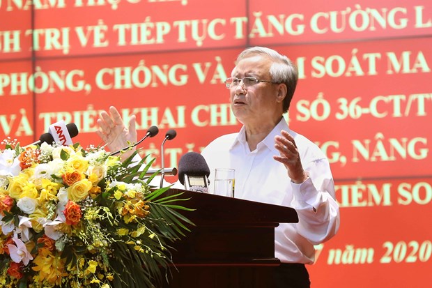 Politburo member and permanent member of the Party Central Committee’s Secretariat Tran Quoc Vuong addresses the meeting in Hanoi on July 9 (Photo: VNA)