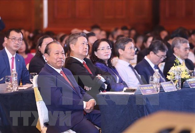 Deputy Prime Minister Truong Hoa Binh attends a forum on economic reconstruction in the “new normal” situation from the perspective of corporate culture held in Hanoi on November 8. (Photo: VNA)