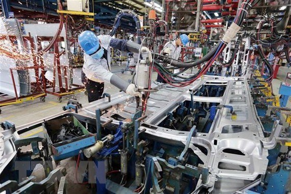 Workers at a car assembly line in northern Vietnam (Source: VNA)