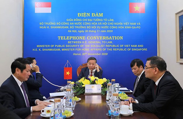 Minister of Public Security General To Lam holds phone talks with Singaporean Minister for Home Affairs and Law K. Shanmugam (Photo: cand.com.vn)