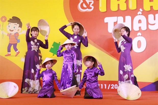 Teachers and children with autism join a performance in a festival for children with autism in HCM City (Photo: VNA)