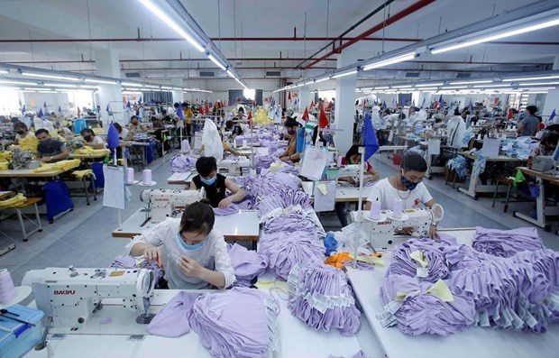 Workers at a textile company in northern Vietnam. (Photo: VNA)