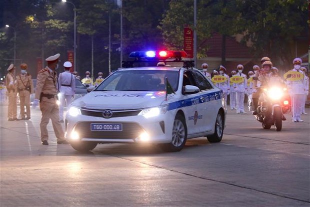 Traffic police officers lead delegations from the Ho Chi Minh Mausoleum to the National Convention Centre. (Photo: VNA)