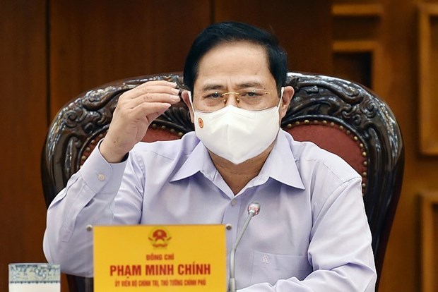 Prime Minister Pham Minh Chinh chairs a meeting of permanent Cabinet members on election organisation amid COVID-19. (Photo: VNA)