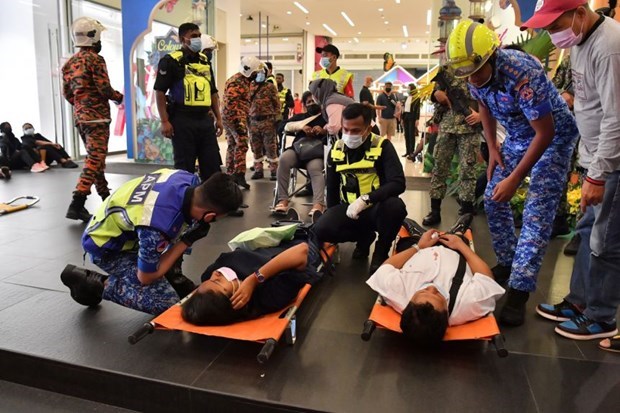 Emergency workers care for victims of a high-speed train accident, at Kampung Baru station on May 24. (Source: straitstimes.com)