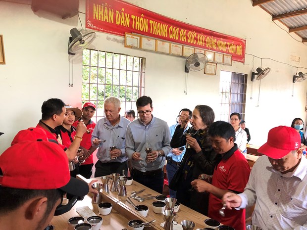 The Swiss ambassador and members of the Embassy team join in a coffee tasting with local farmers in Krong Nang District, Dak Lak Province participating in a Swiss financed project supporting sustainable coffee production. Photo courtesy of Swiss Embassy in Vietnam