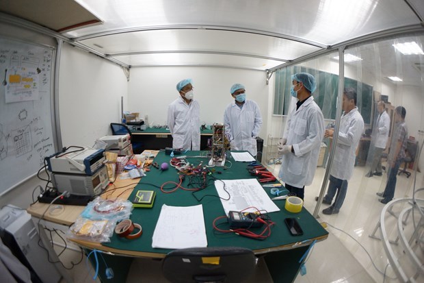 VNSC scientists work on making the satellite (Photo: VNSC )