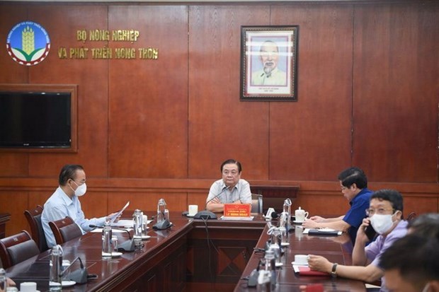 Minister of Agriculture and Rural Development Le Minh Hoan chairs the conference in Hanoi. (Photo: Ministry of Industry and Trade)