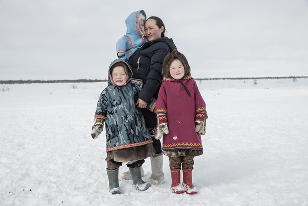 The first prize with a 500 USD cash prize goes to Russian photographer Yulia Nevskaya for a shot featuring a family of small indigenous people far north of the country (Photo: https://www.all-about-photo.com/)