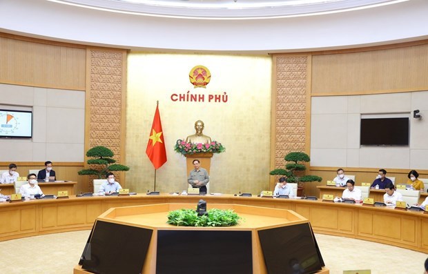 Prime Minister Pham Minh Chinh speaks at the meeting. (Photo: VNA)