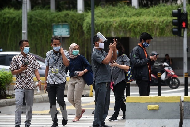 People wearing face masks in Indonesia - Illustrative image (Photo: xinhua/VNA)