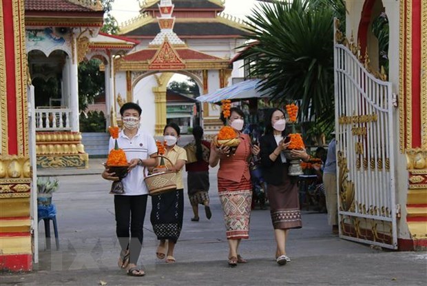 People attend ThatLuang festival in Laos (Photo: VNA)