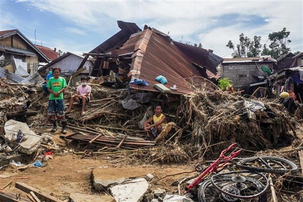 Houses in Bais city of the Philippines are destroyed by Typhoon Rai. (Photo: AFP/VNA)