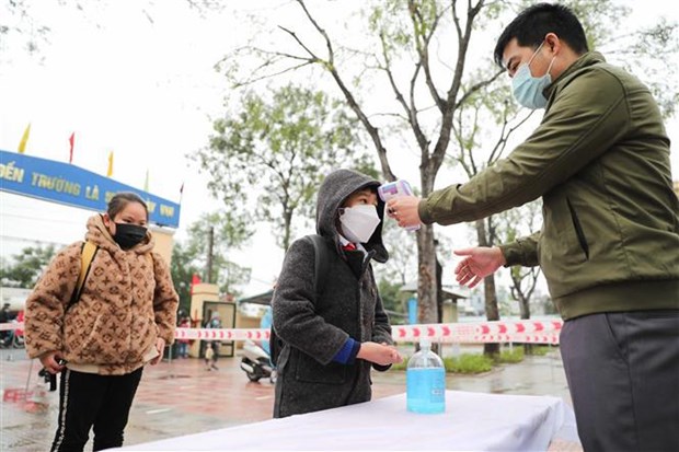 Students have their health checked when returning to school (Photo: VNA)