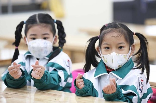 First graders in Hanoi's Gia Lam district on their first day at school (Photo: VNA)